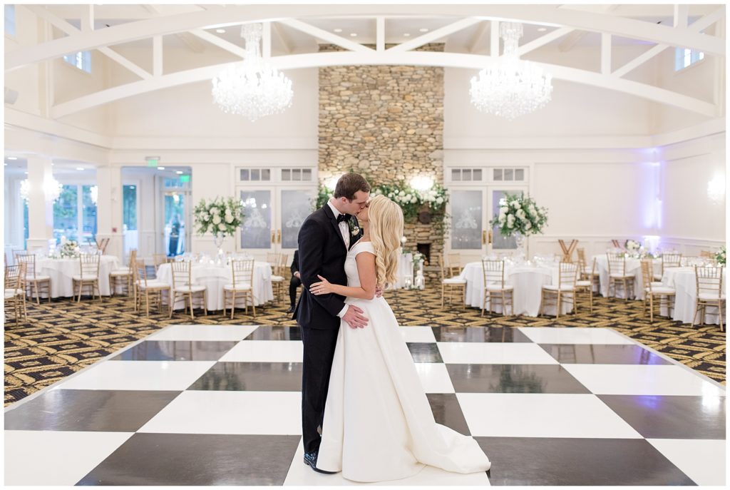 bride and groom dancing in reception hall 
