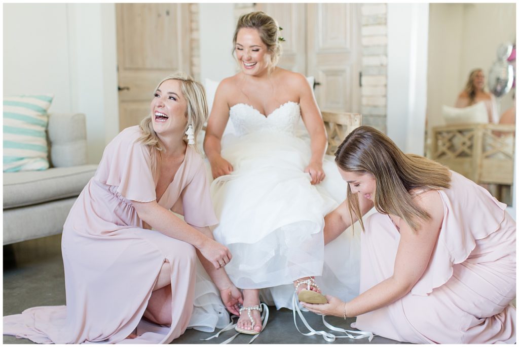 bridesmaids and bride getting ready in bridal suite
